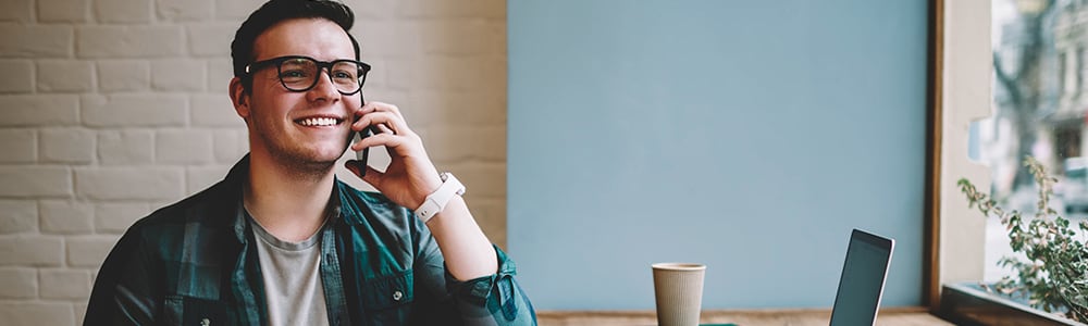 Male talking on phone to build a referral source